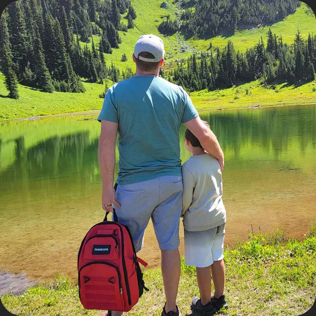 Family with 72hr kit camping by lake. Bug out bug for outdoor safety, protection from weather and fire starter included. Fire starting kit.