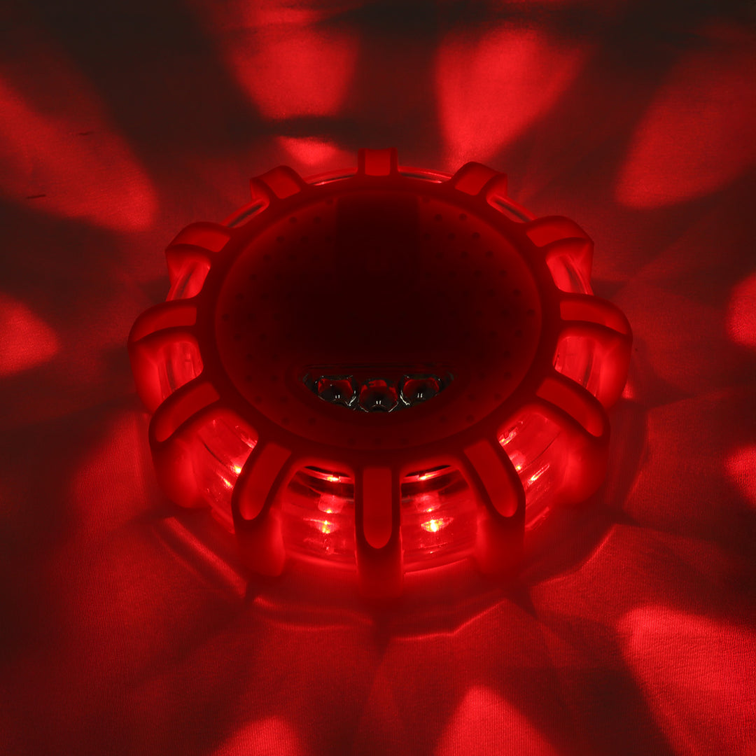 Powerful LED roadside flare emitting a strong red light, increasing visibility during emergencies in fog, rain, or at night
