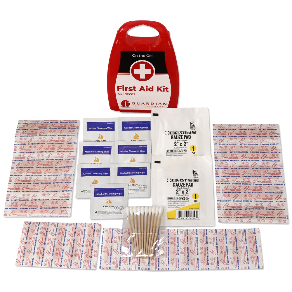 First aid kit with various first aid and wound care supplies on a white background