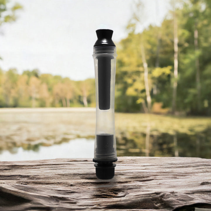 Water purification straw for filtering lake and river water on a log