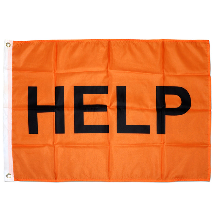 Neon orange signalling flag with HELP written on it for search and rescue operations when lost. 