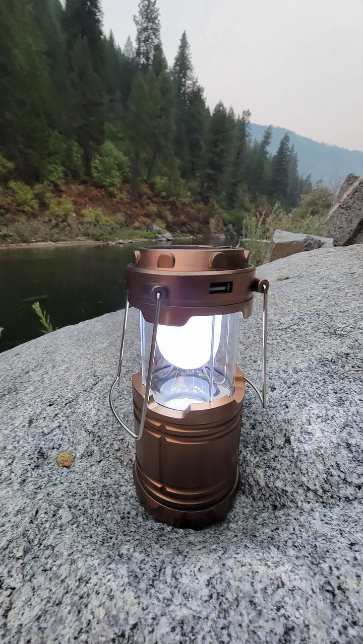 Solar lantern with cell phone charging expanded