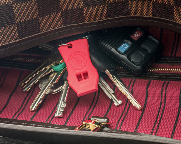 Emergency ICE alert whistle in orange with keychain. 