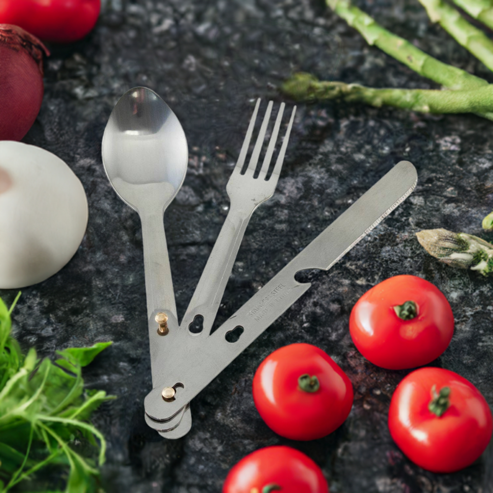 Stainless Steel utensil set for camping and emergencies on countertop. Foldable knife, fork and spoon. 
