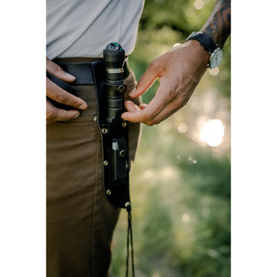 Survival knife on persons hip