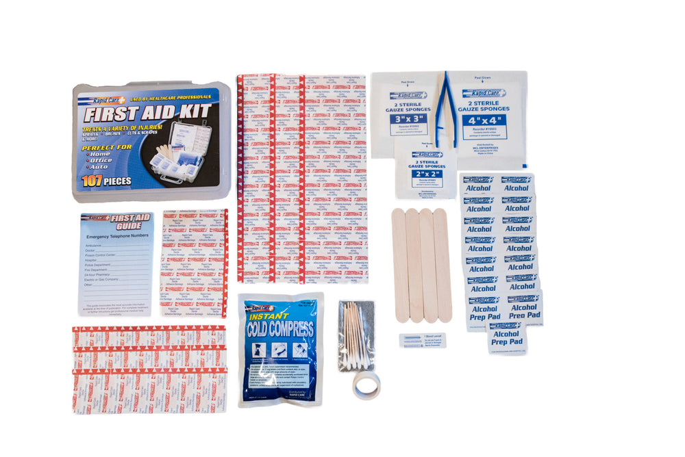 Contents of a 107-piece first aid kit laid out, showcasing bandages, antiseptic wipes, gauze, and other essential medical supplies for emergencies