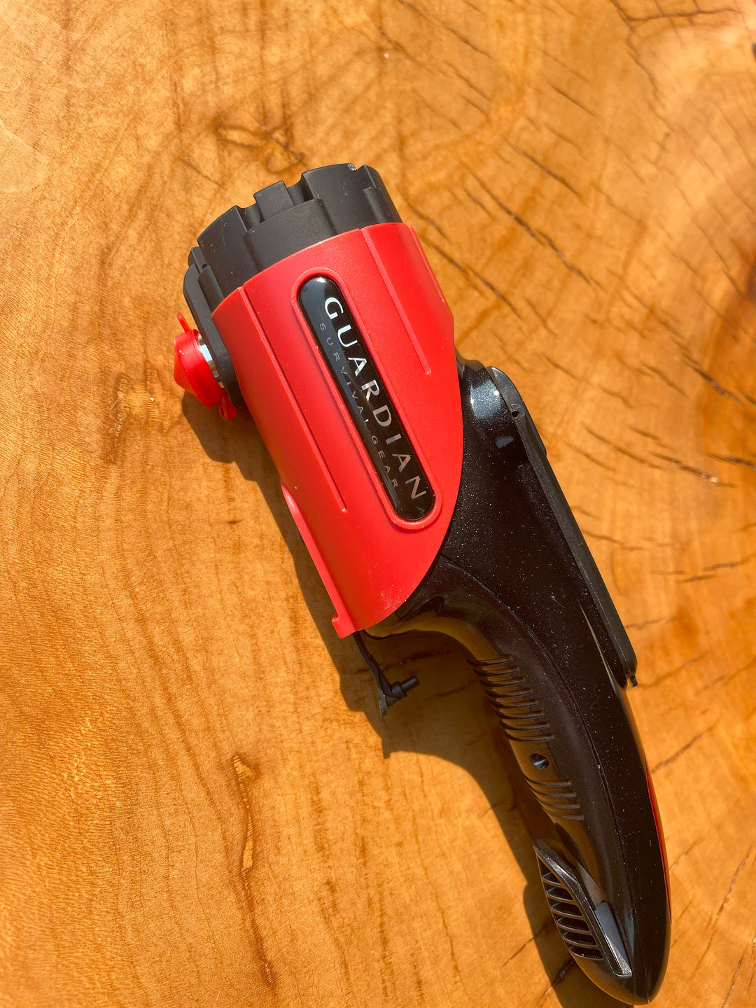 Auto flashlight for emergencies and outdoor travelling on wood stump. Dynamo hand crank powered never needs batteries. 