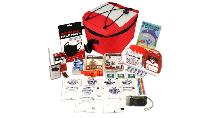 Children's Bug Out Pal emergency kit displayed with all contents arranged around a red insulated cooler bag. The kit includes emergency food rations, emergency drinking water pouches, a 44-piece first aid kit, AM/FM radio, reusable face mask, emergency Mylar sleeping bag, emergency poncho, dynamo flashlight, survival whistle, pocket tissues, water purification tablets, crayons, and a children's coloring book. Designed for child emergency preparedness, evacuation, and disaster readiness.