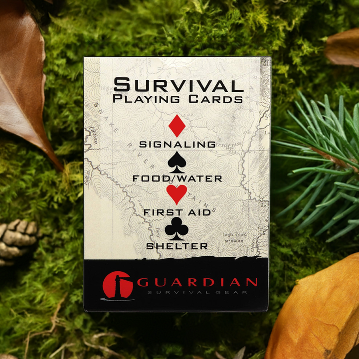 Survival tip playing cards in the forest when camping