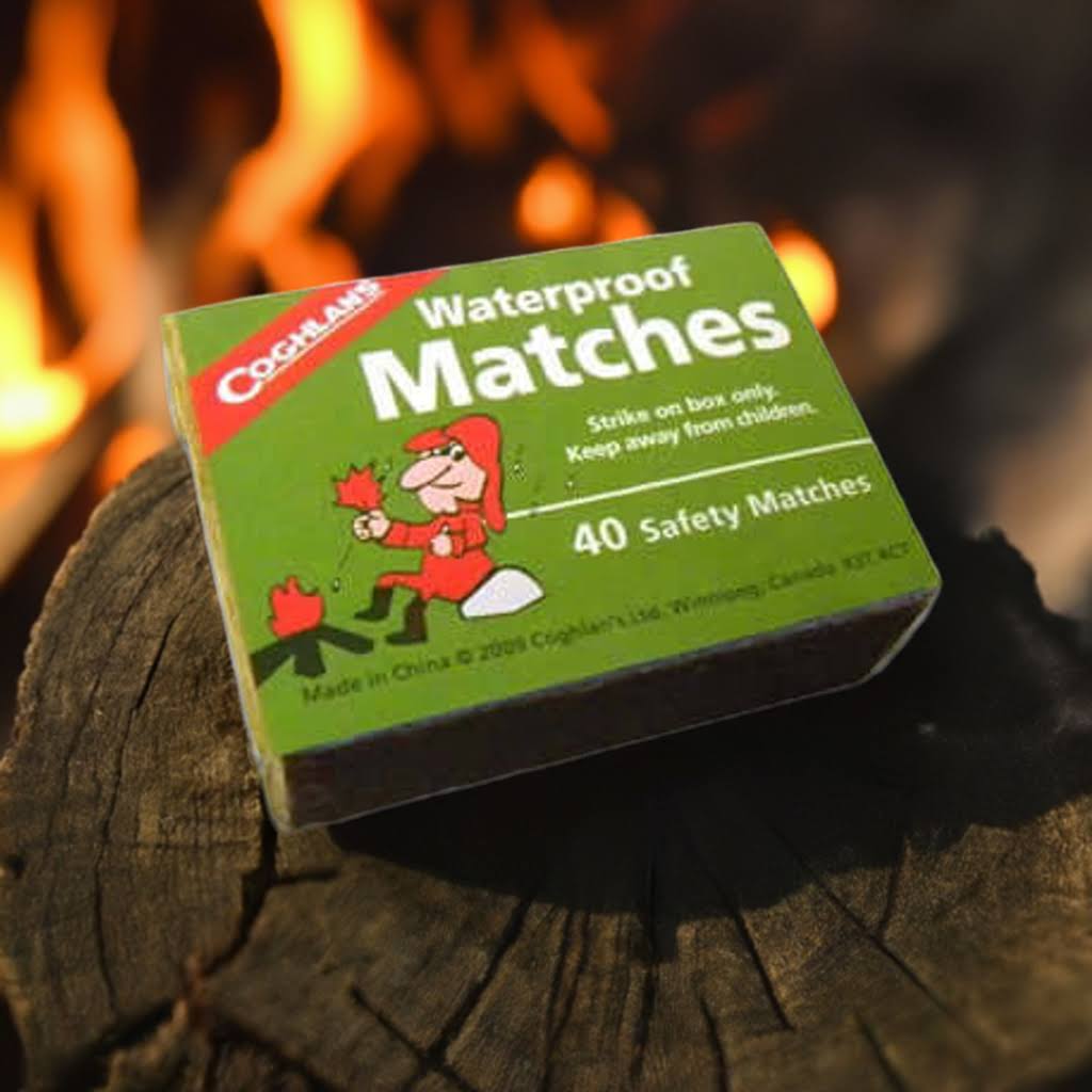 Waterproof matches next to campfire