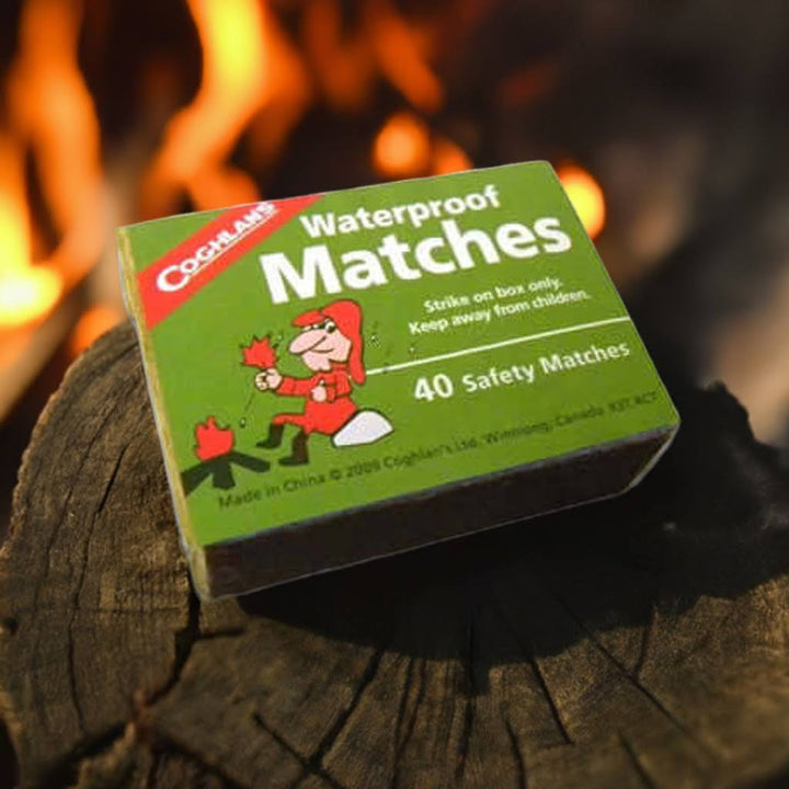 Waterproof matches next to campfire